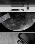 Deep black space desk pad 40x20 inches in dusty gray tones with a soft silvery, cozy glow.