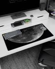 Craters and silvery moon floating above speckled stars mouse pad, 32x16 inches, roomy desk mat.