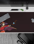 Megumin KonoSuba anime desk pad 40x20 inches, deep plum with Megumin shouting "Explosion!" in bold red outfit and staff.