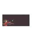 Anime mouse pad featuring Megumin from KonoSuba, 28x12 inches. Plum backdrop highlights her red outfit and staff.