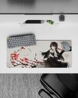 Moody ink-wash gray anime mouse pad 28x12 inches with crimson rose accents and sharp red-eyed vibe.