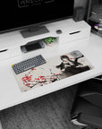 Raven-haired doll-like anime heroine mouse pad 28x12 inches amid branches and scattered red blossoms.