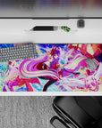 Neon candy color desk pad 36x16 inches in pink, violet, and purple with stars, cards, and glowing light.