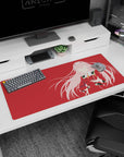 Artistic 36x16 inches mouse pad featuring Zero Two in silhouette with deep red backdrop and pink accents for a bold, modern effect.