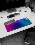 Colorful 28x12 inches gradient mouse pad with purples, pinks, and blues, blending vibrant energy with sleek style.