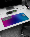 Vibrant 32x16 inches gradient mouse pad showcasing purples, pinks, and blues, ideal for adding color and focus to your setup.
