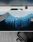 Serene 40x20 desk pad with cool-toned blue peaks and a glowing moon, perfect for creating a peaceful atmosphere while working or relaxing