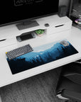 Serene 32x12 mouse pad featuring blue mountain peaks and a glowing moon, perfect for a peaceful, productive workspace atmosphere