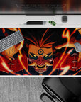40x20 inches Naruto desk pad in fiery orange, deep red, and midnight blue with intense yellow-eyed menace.