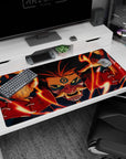 40x20 inches desk pad showing Kurama staring forward as swirling flames wrap around his face and reaching claws.