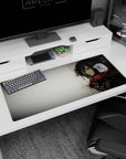 Fierce yet solemn 36x16 anime desk mat with Mikasa Ackerman wrapped in her red scarf, showcasing her quiet strength and graceful presence in grayscale watercolor