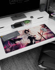 Artistic 36x16 inches desk pad with Jeanne d'Arc Alter, blending vengeance and power with a dynamic swirl of pink petals.