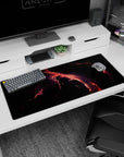 Lightning-like rivers of coral and red across dark space desk pad 36x16 inches with stardust specks.