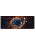 Galaxy swirl desk mouse pad 32x12 inches with star-speckled cosmic pattern on dark background.