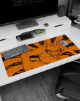 Kurama the Nine-Tails lunging with wild grin across anime desk pad 36x16 inches, bold manga look.