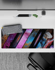 Cosmic gradient mouse pad 32x12 inches in purple, electric blue, pink, and smoky black tones.