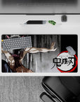 Inosuke Demon Slayer anime mouse pad, 32x16 inches, featuring boar mask and primal stance on gritty charcoal background.