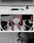 Chilling 32x16 mouse pad featuring Makima with spiral eyes and eerie hands, ideal for fans of dark and sinister anime designs
