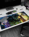 40x20 inches Naruto Shippuden desk pad showing Sasuke cool-toned and Naruto in chakra mode with orbs.