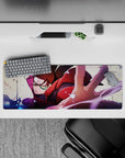 32x12 inches anime desk mat in crimson, purple, and inky blue splashes, stormy energy for gaming.