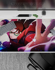 Vibrant 40x20 inches anime desk pad in crimson, purple, and inky blue sparks for a high-energy setup.