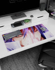 Anime mouse pad 32x16 inches showing a red-eyed fighter with flowing violet hair, locked-in stare, mid-attack focus.