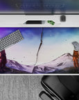 Lavender-to-icy blue anime desk pad 40x20 inches, calm storm mood with drifting ash over mountains.