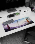 Naruto Uzumaki and Sasuke Uchiha faceoff across a jagged crack desk mat mouse pad 32x12 inches.