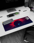 Giant red-rayed planet sunrise mouse pad 32x12 inches set in a purple starfield with teal light beams.