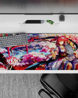 Dreamy 36x16 inches anime desk pad in sakura pink, lantern red, and cool river blue with drifting petals.