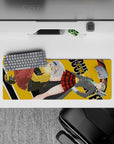 Dark-playful anime mouse pad 32x12 inches in gray, green, red plaid, and mustard tones with swirling scythe energy.
