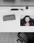 Nezuko anime mouse pad, 14x10 inches, features her serene gaze and flowing black hair with red tips on a white background.