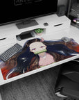 Nezuko anime desk pad 40x20 inches with serene gaze, black hair with red tips, on white with gold flecks.