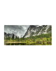 Mouse pad featuring serene nature design, 28x12 inches, with towering pines, misty mountains, and calm waters for a peaceful desk effect.
