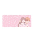 28x12 inches anime mouse pad with laughing girl hugging boy, blush pink background and cute doodle accents.