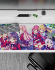 36x16 inches anime desk pad in soft pink, cherry red blazers, navy hair, and bright sky highlights.