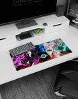 Anime duo mouse pad 28x12 inches with dark-haired mage holding a purple orb vs blonde heroine in teal.