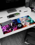 36x16 inches anime desk pad with dark-haired mage holding purple orb facing blonde heroine in teal.