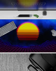 Retro-futuristic 40x20 desk pad showcases glowing sunset and starry skies with striking grid aesthetics for fans