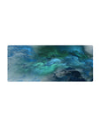 Mouse pad featuring oceanic abstract design, 28x12 inches, with blue and green hues for a dynamic and tranquil workspace atmosphere.