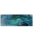 Compact 32x12 inches mouse pad with oceanic abstract design, showcasing swirling blue and green hues for a serene, calming effect.