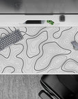 40x20 inches desk pad with black and white contour design, showcasing bold black lines on a white backdrop for a sleek, minimalist aesthetic.