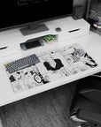 Blonde anime girl smirking with side-swept bangs in a deep V black top on desk pad, 32x16 inches.