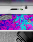 Neon 36x16 desk pad with swirling bursts of pink, electric blue, and vivid purples, ideal for bringing bold energy to your workspace