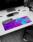 Electric 32x12 mouse pad with bright pink, electric blue, and vivid purples, creating an exciting and colorful workspace design