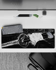 Intense 32x12 mouse pad features the warrior’s grip and gleaming blade with intricate shadow details for fans of bold artistry