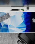 Bold 40x20 desk pad with geometric shapes in icy blue tones and deep blue gradients for a cool, crystalline aesthetic