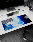 Bold 32x16 mouse pad with deep blue gradients and icy blue geometric shapes for a cool, sleek modern aesthetic