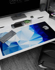 Sleek 40x20 anime desk mat featuring icy blue gradients and faceted geometric shapes, perfect for a modern, cool workspace