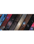 Galaxy collage desk pad with bold diagonal panels and star-speckled night sky, 36x16 inches.